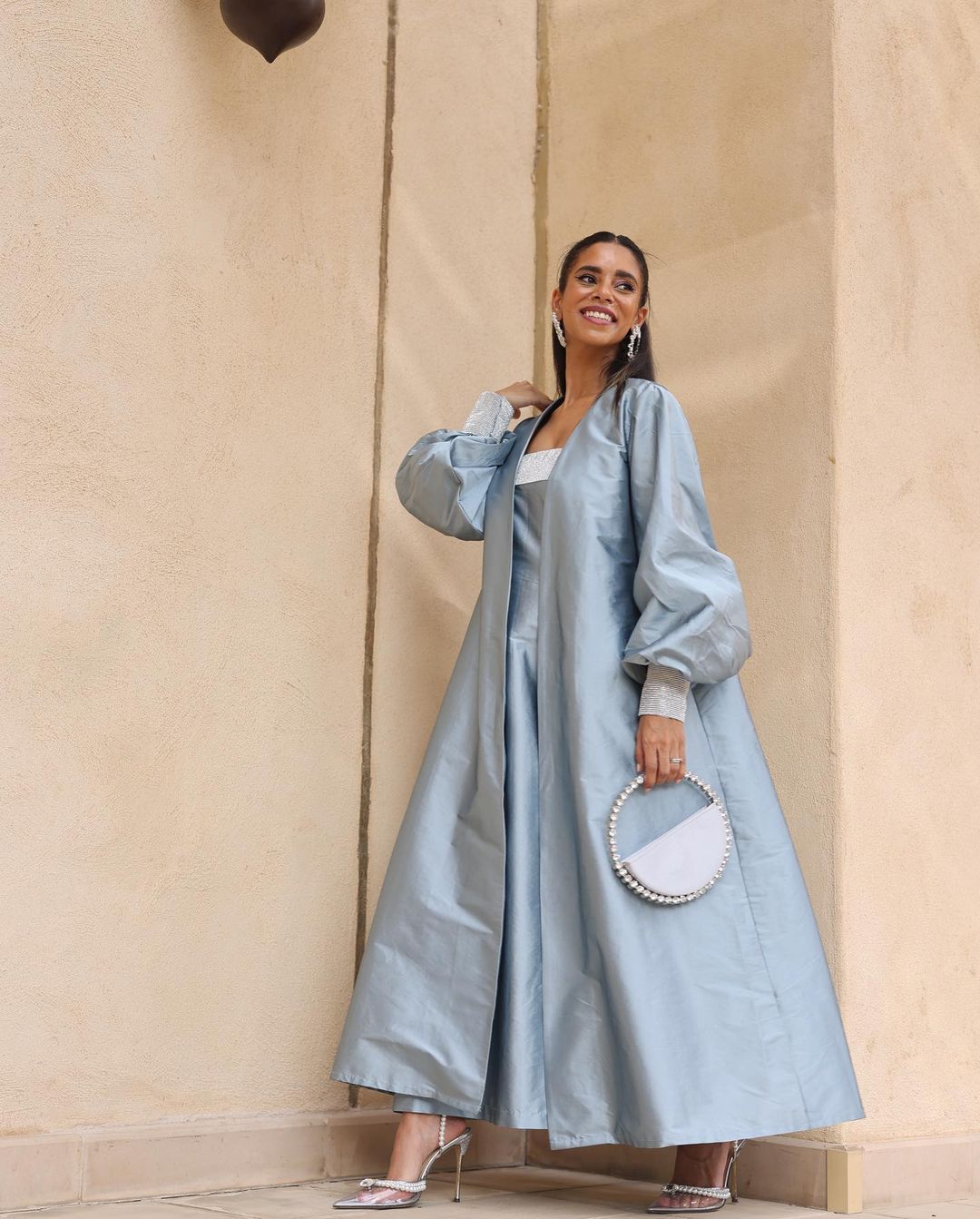 Nadya Hasan with SILVER ETERNITY CLUTCH