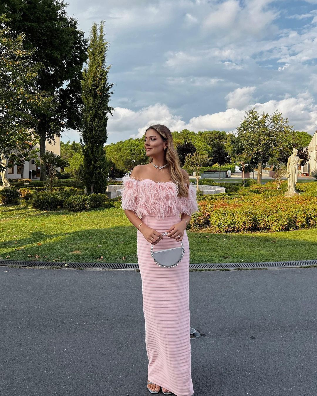Büşra Neziroğluları with Silver Taliya Eternity Clutch